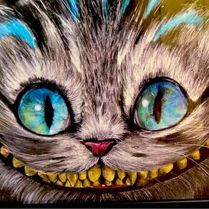 Comes with black frame. Crazy cat.